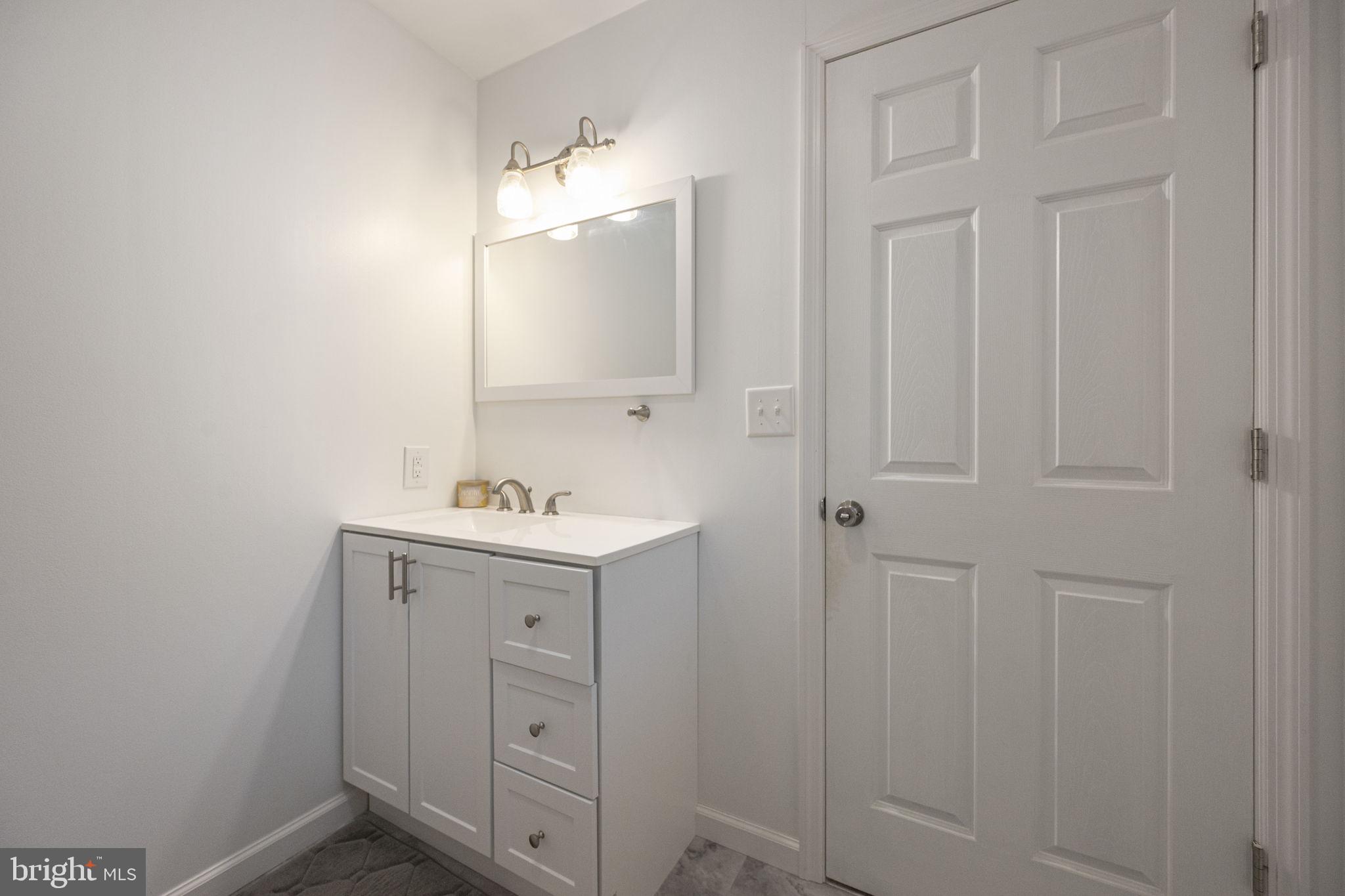 150 Modena Road Coatesville, PA 19320 - Photo 21 of 31 a bathroom with a sink and a mirror