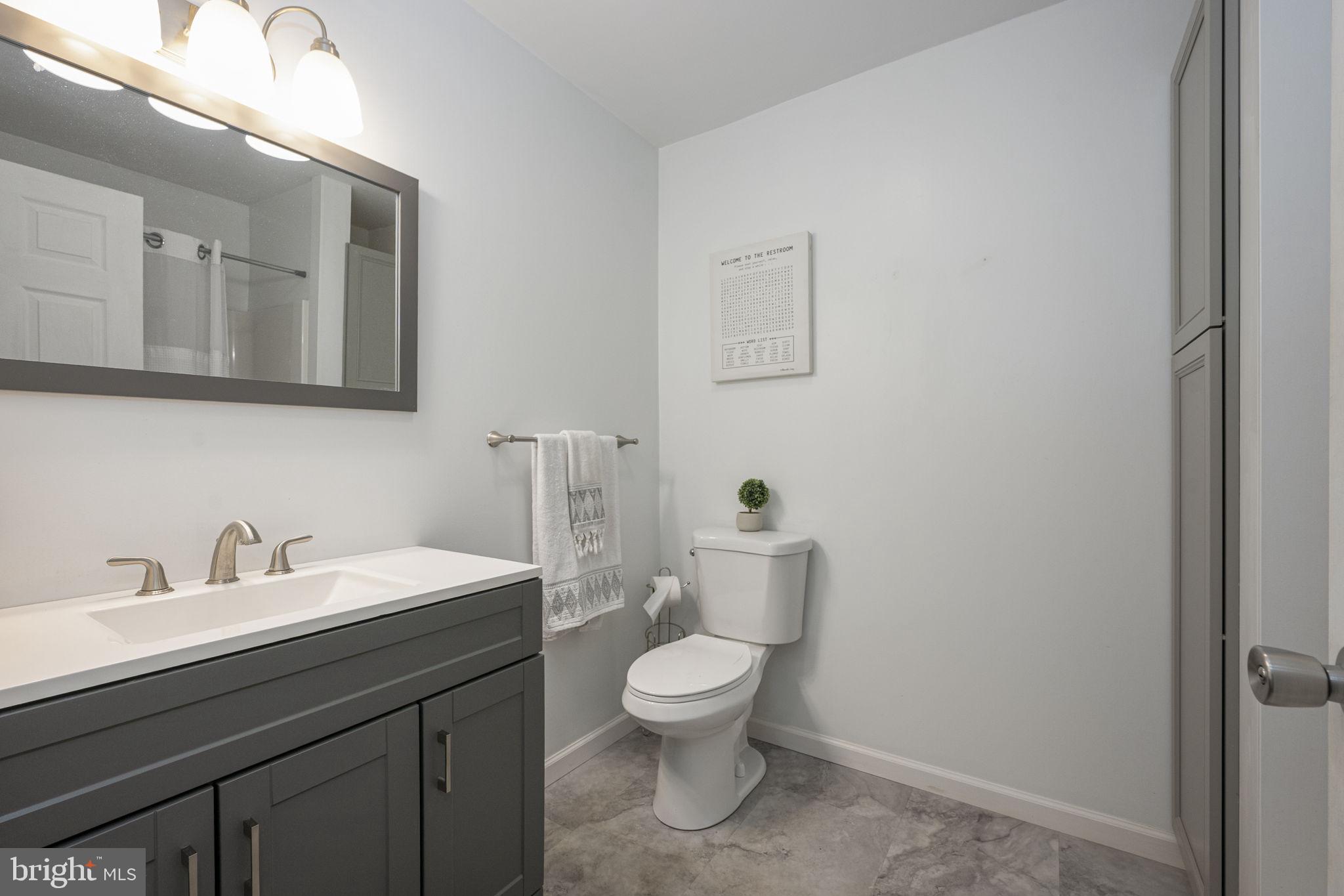 150 Modena Road Coatesville, PA 19320 - Photo 23 of 31 a bathroom with a toilet a sink and mirror