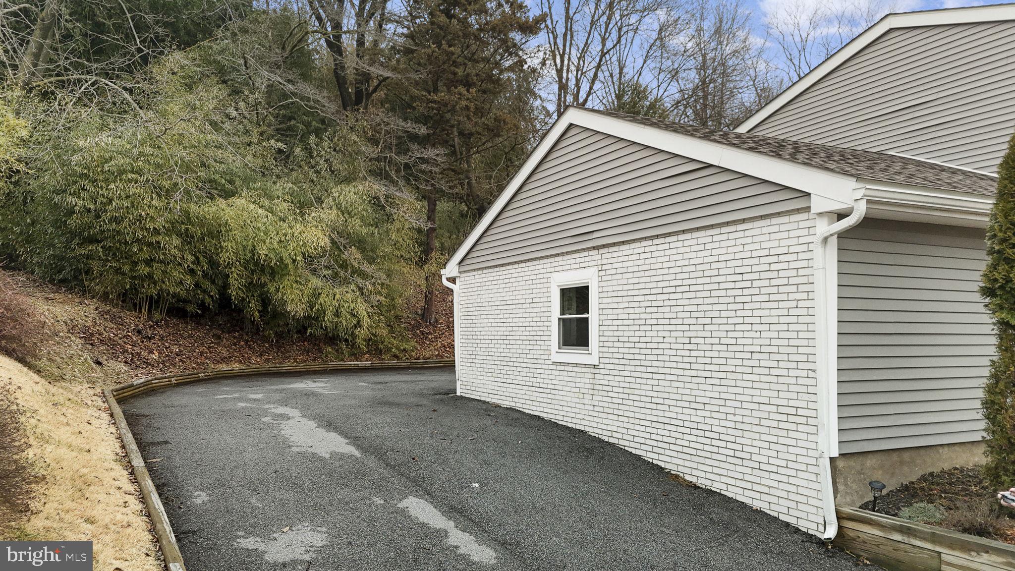 150 Modena Road Coatesville, PA 19320 - Photo 4 of 31 a view of a white house with large trees