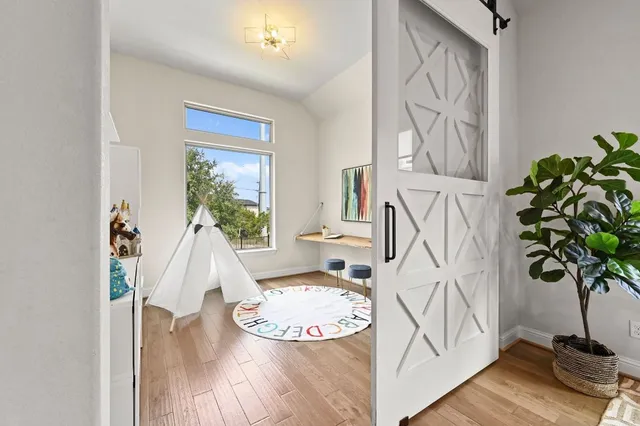 a bed room with a bed and a window