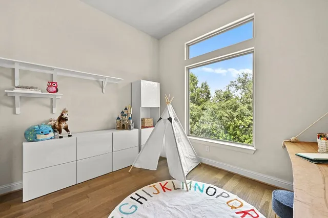 a spacious bedroom with a bed and a couch