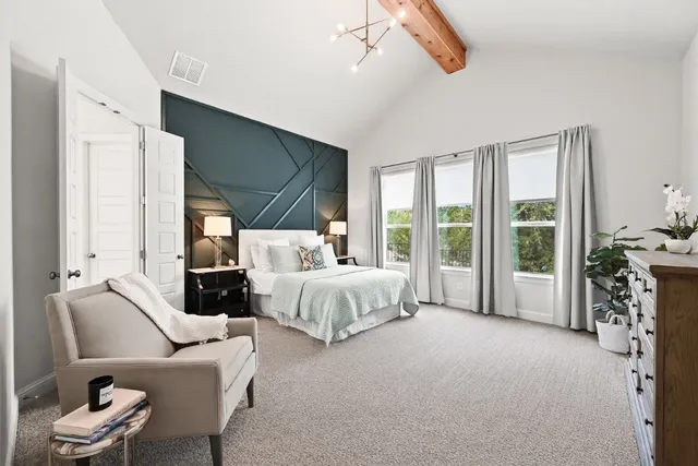 a bedroom with a bed and window