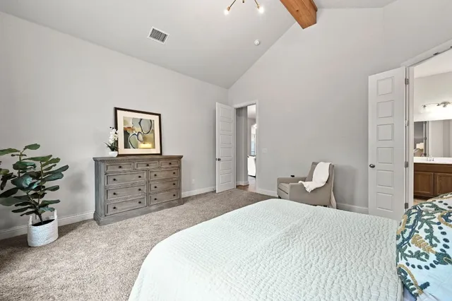 a spacious bathroom with a tub sink double vanity and mirror