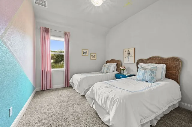 a bedroom with furniture and a bed