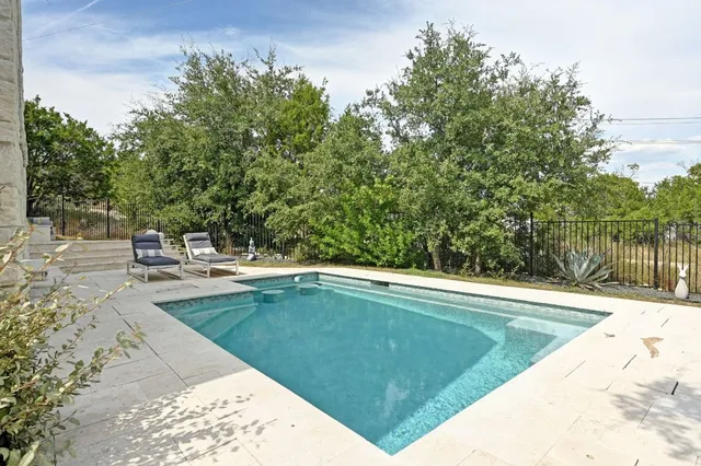 a view of a patio with couches and potted plants