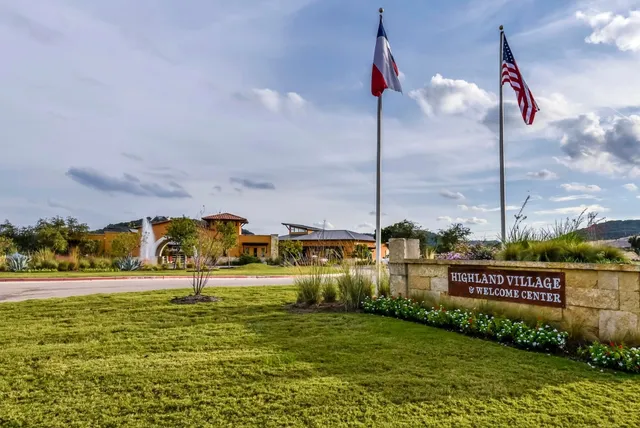 a view of a pool with table and chairs