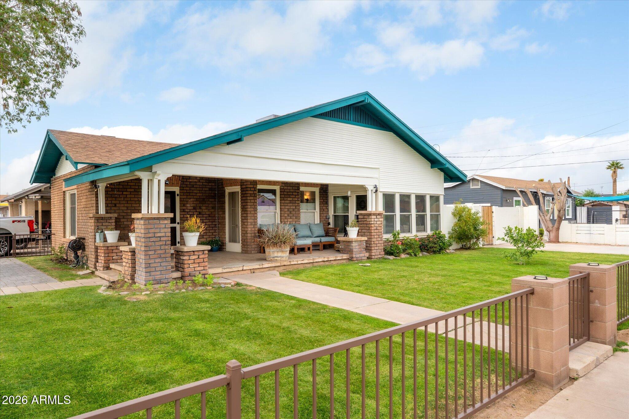 1348 East Fillmore Street Phoenix, AZ 85006 - Photo 1 of 41 a view of a house with a yard and sitting area