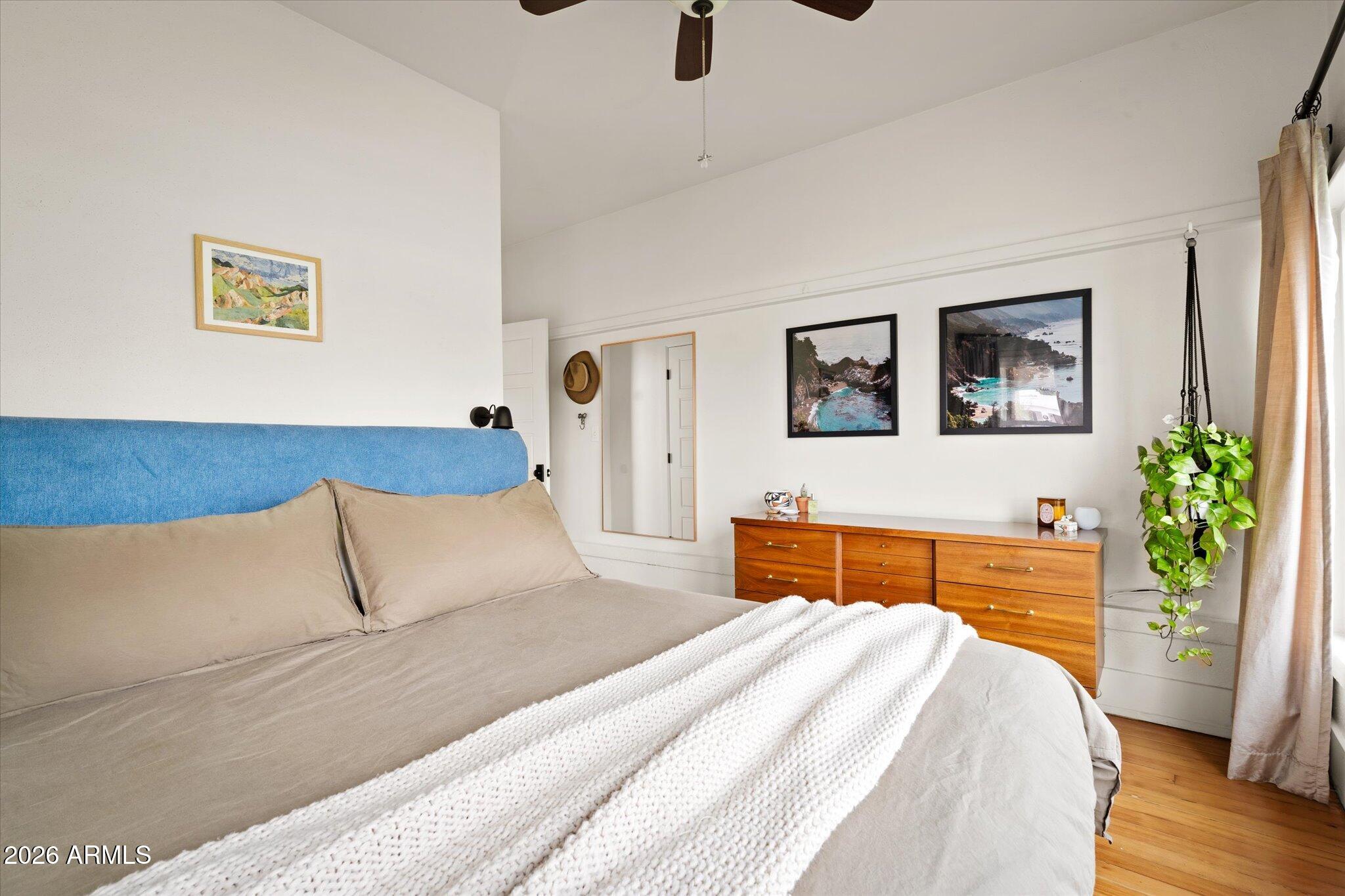 1348 East Fillmore Street Phoenix, AZ 85006 - Photo 24 of 41 a bedroom with a bed and a painting on the wall
