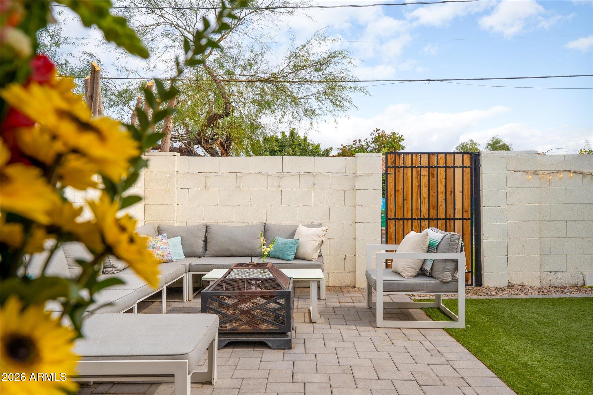 1348 East Fillmore Street Phoenix, AZ 85006 - Photo 33 of 41 a backyard of a house with table and chairs