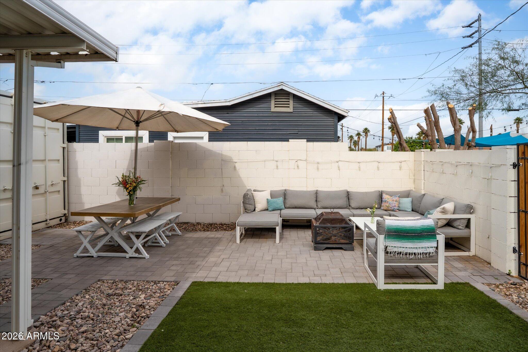 1348 East Fillmore Street Phoenix, AZ 85006 - Photo 35 of 41 a patio with table and chairs