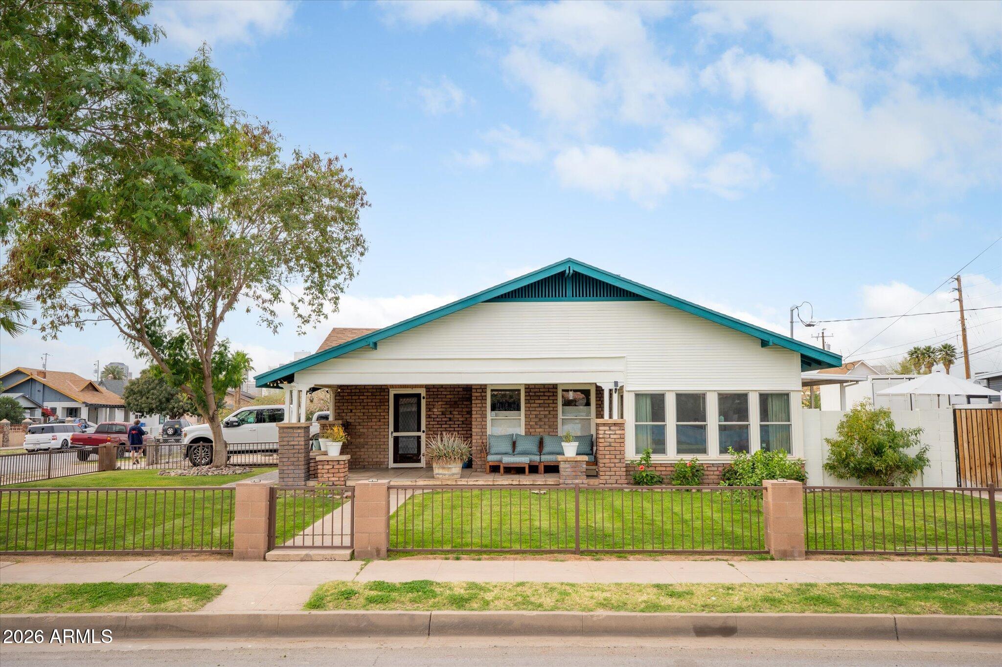 1348 East Fillmore Street Phoenix, AZ 85006 - Photo 39 of 41 a front view of a house with a garden