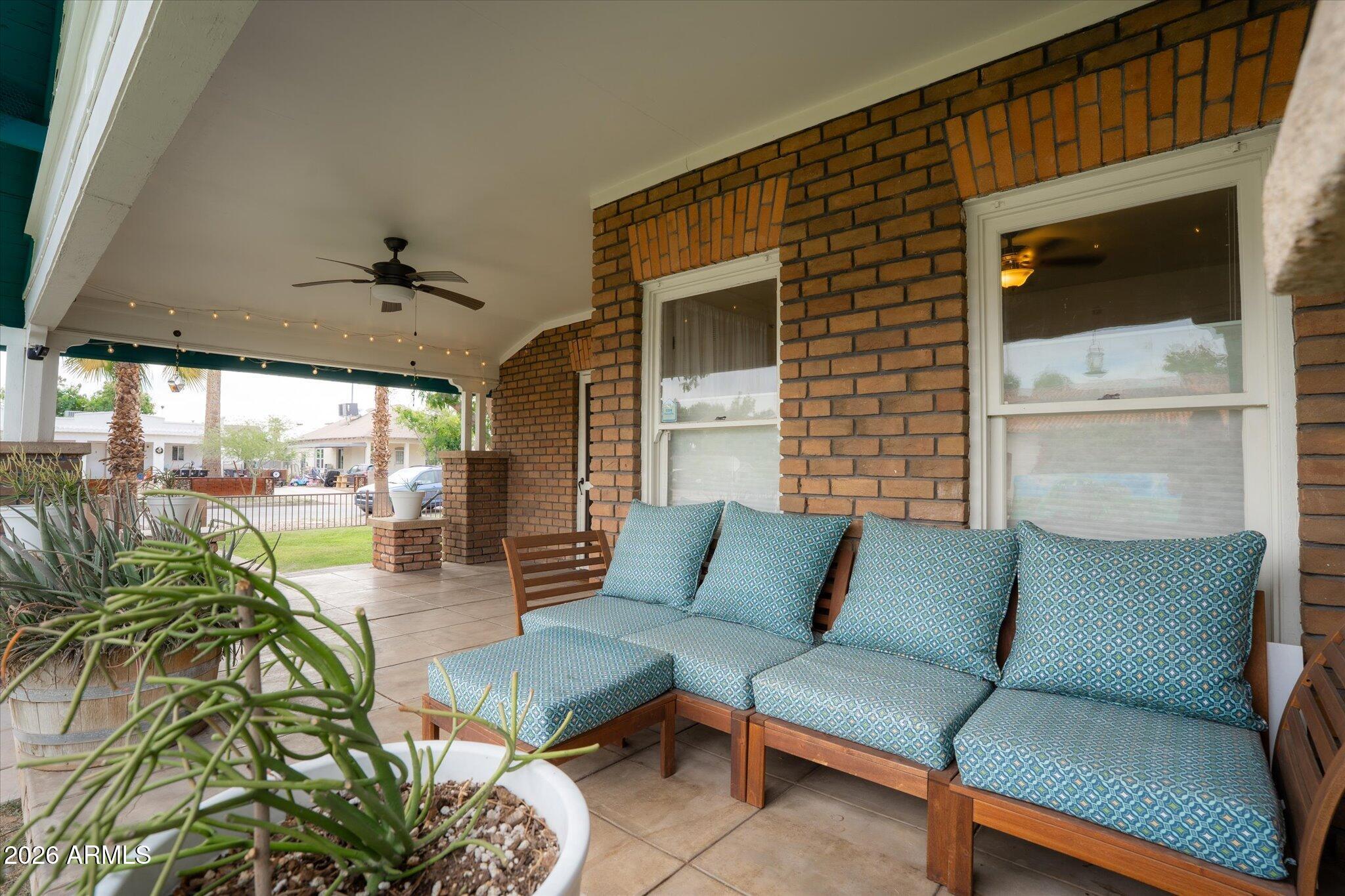 1348 East Fillmore Street Phoenix, AZ 85006 - Photo 4 of 41 a outdoor living space with furniture and a potted plant