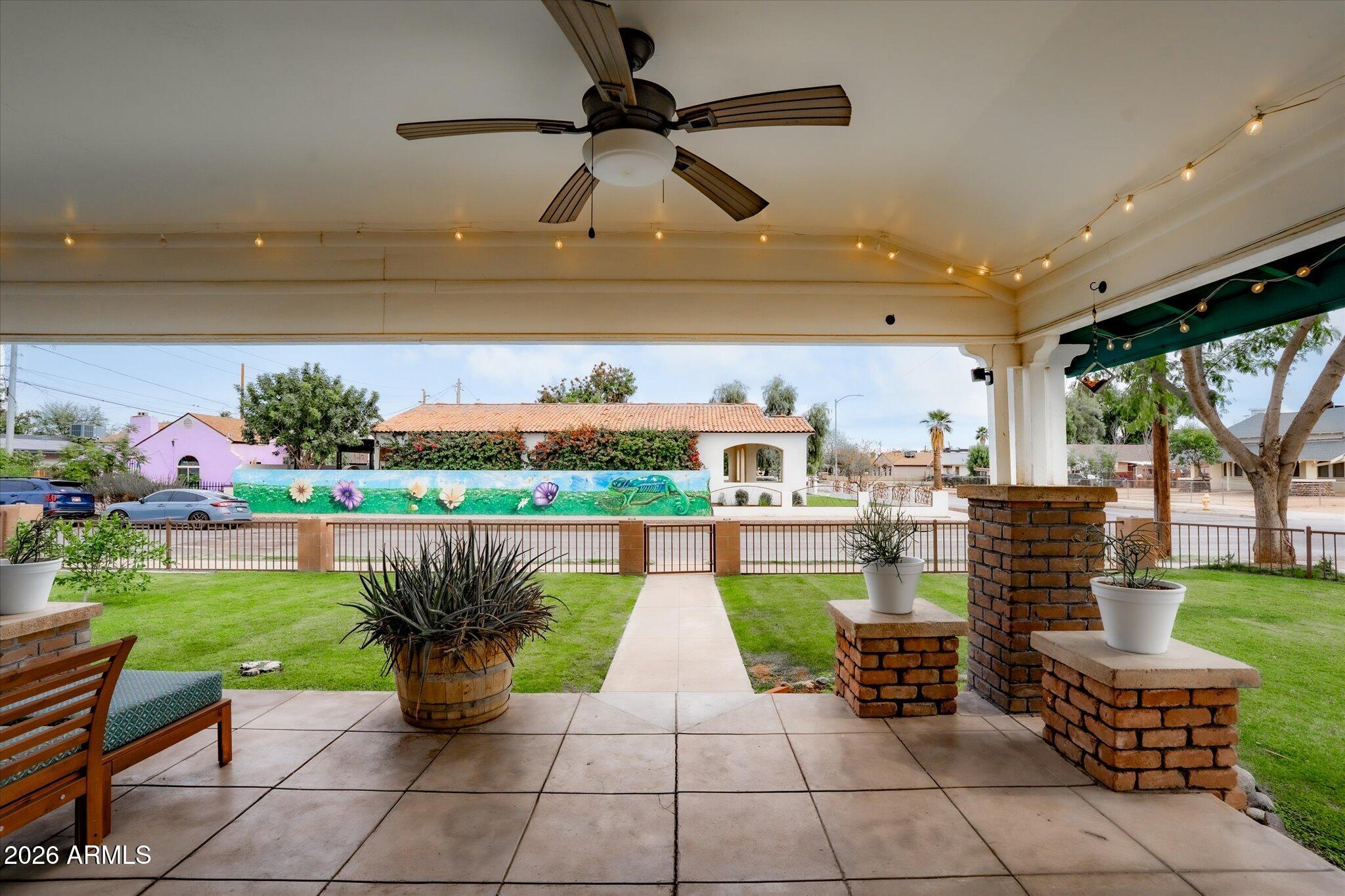 1348 East Fillmore Street Phoenix, AZ 85006 - Photo 5 of 41 a view of a patio with plants and a table and chairs