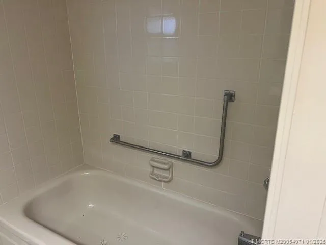 a bathroom with a sink toilet and mirror