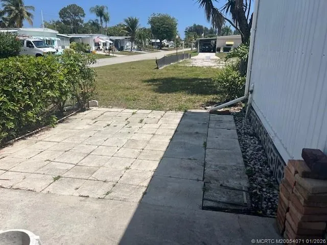 a backyard of a house with lots of green space