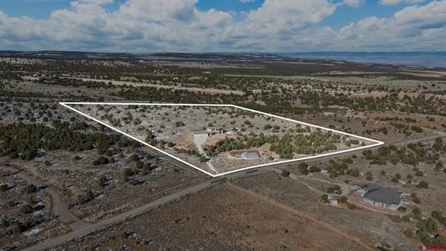 a en suite bathroom with a sink a mirror and a shower