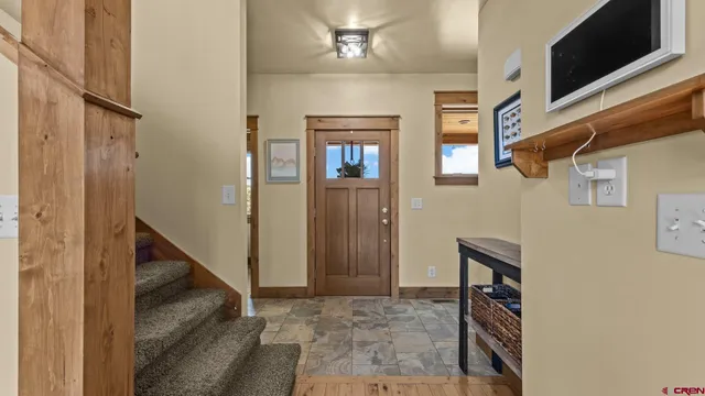 a bedroom with a bed and a potted plant
