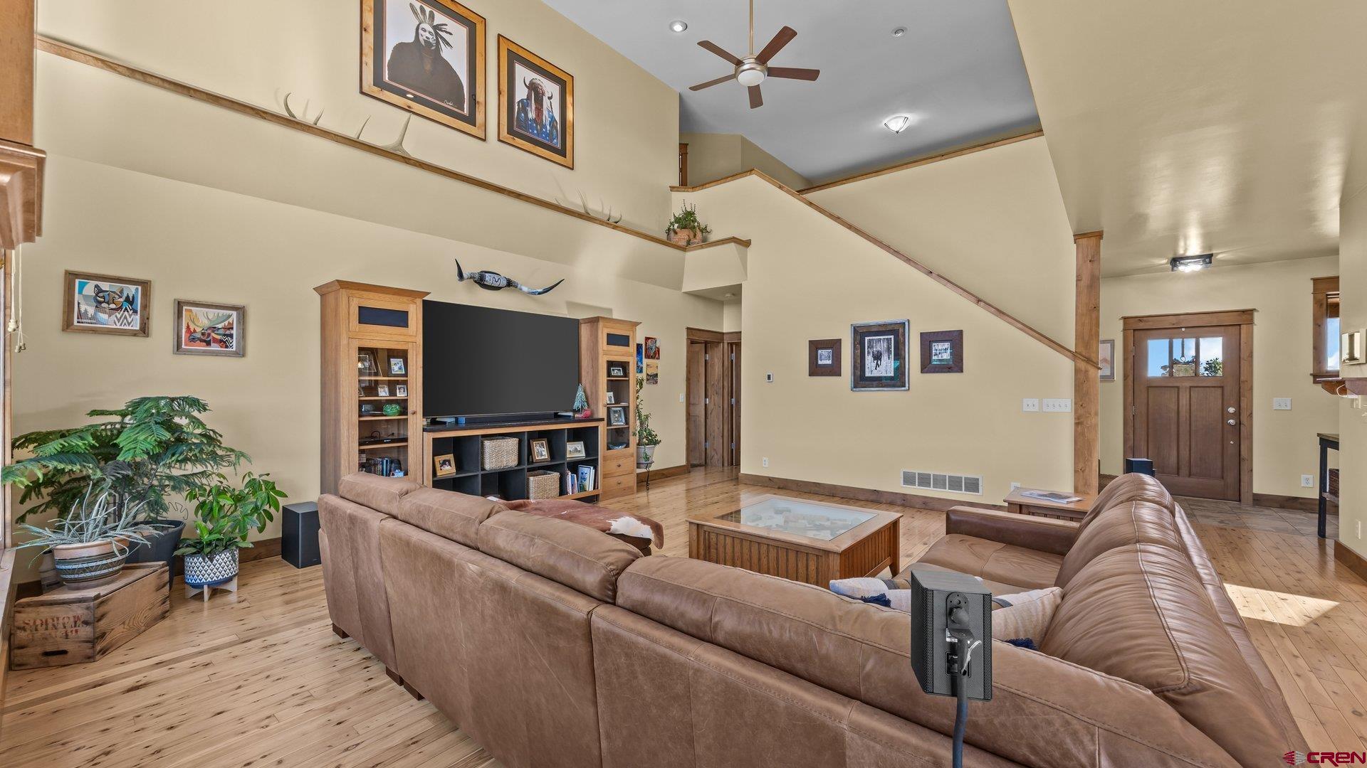 2601 South 21 1/2 Road Glade Park, CO 81523 - Photo 21 of 45 a living room with furniture and a flat screen tv
