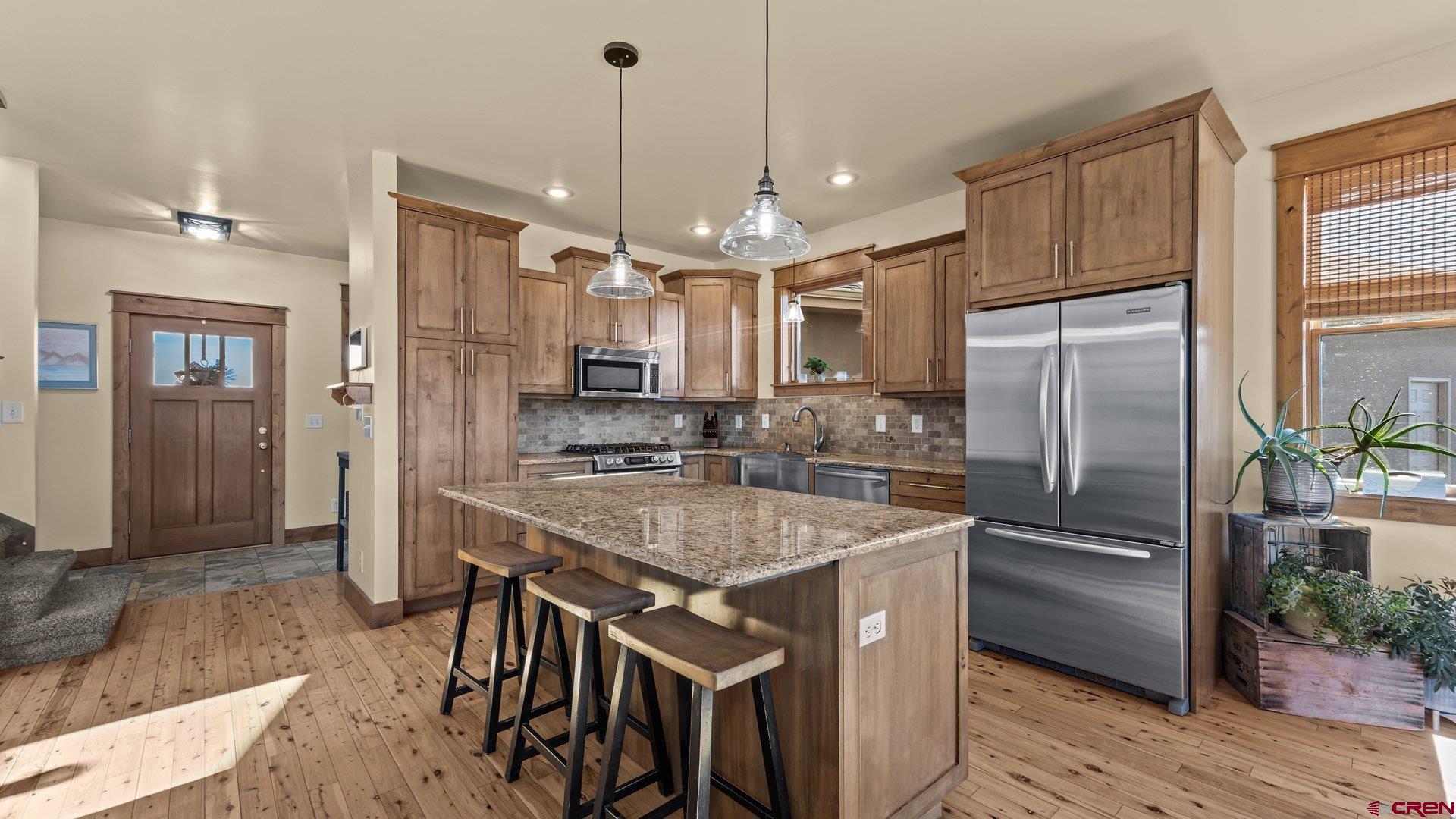 2601 South 21 1/2 Road Glade Park, CO 81523 - Photo 23 of 45 a kitchen with stainless steel appliances granite countertop a refrigerator a sink a stove and a refrigerator