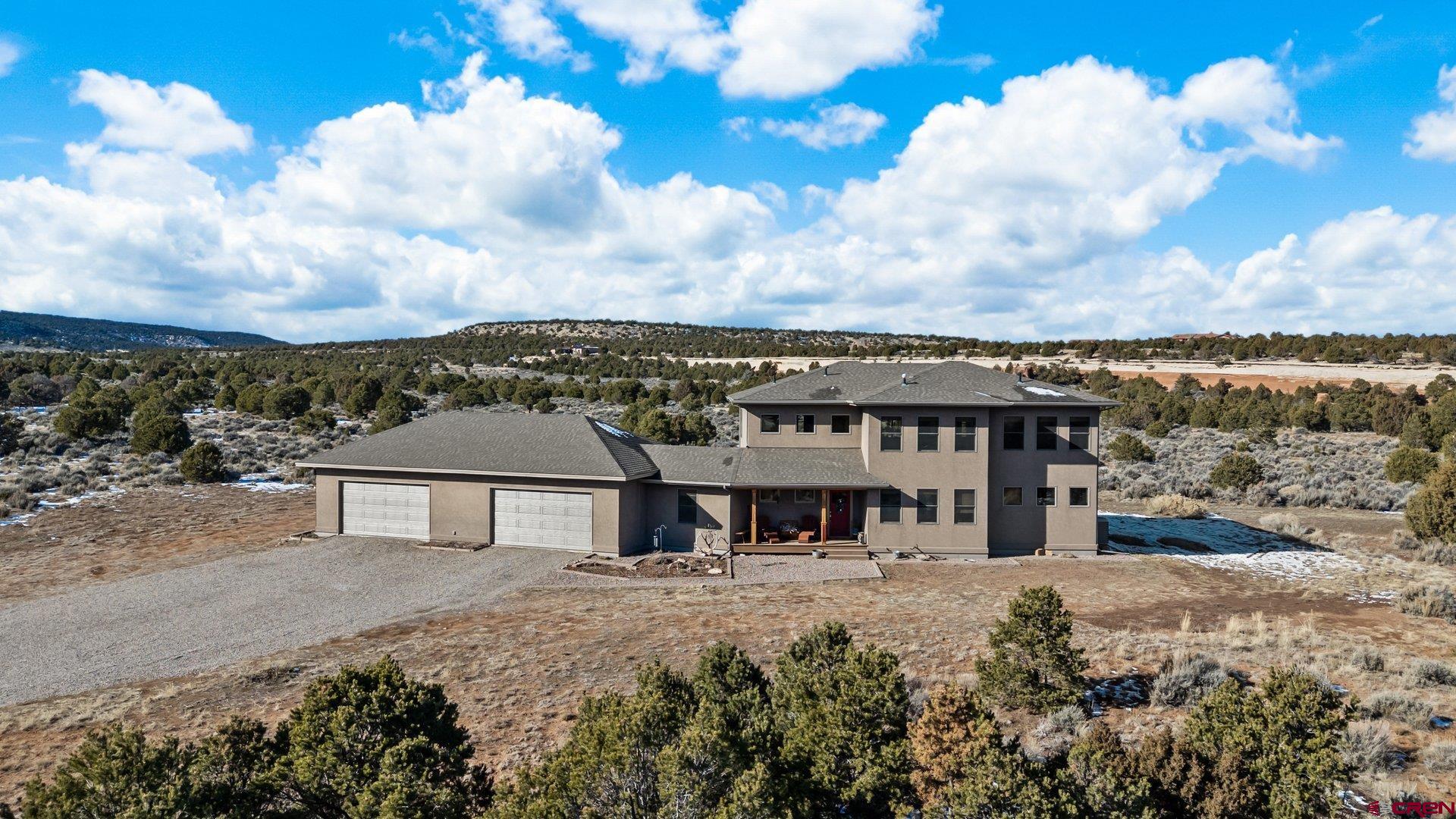 2601 South 21 1/2 Road Glade Park, CO 81523 - Photo 3 of 45 a view of a big house with a big yard and large tree