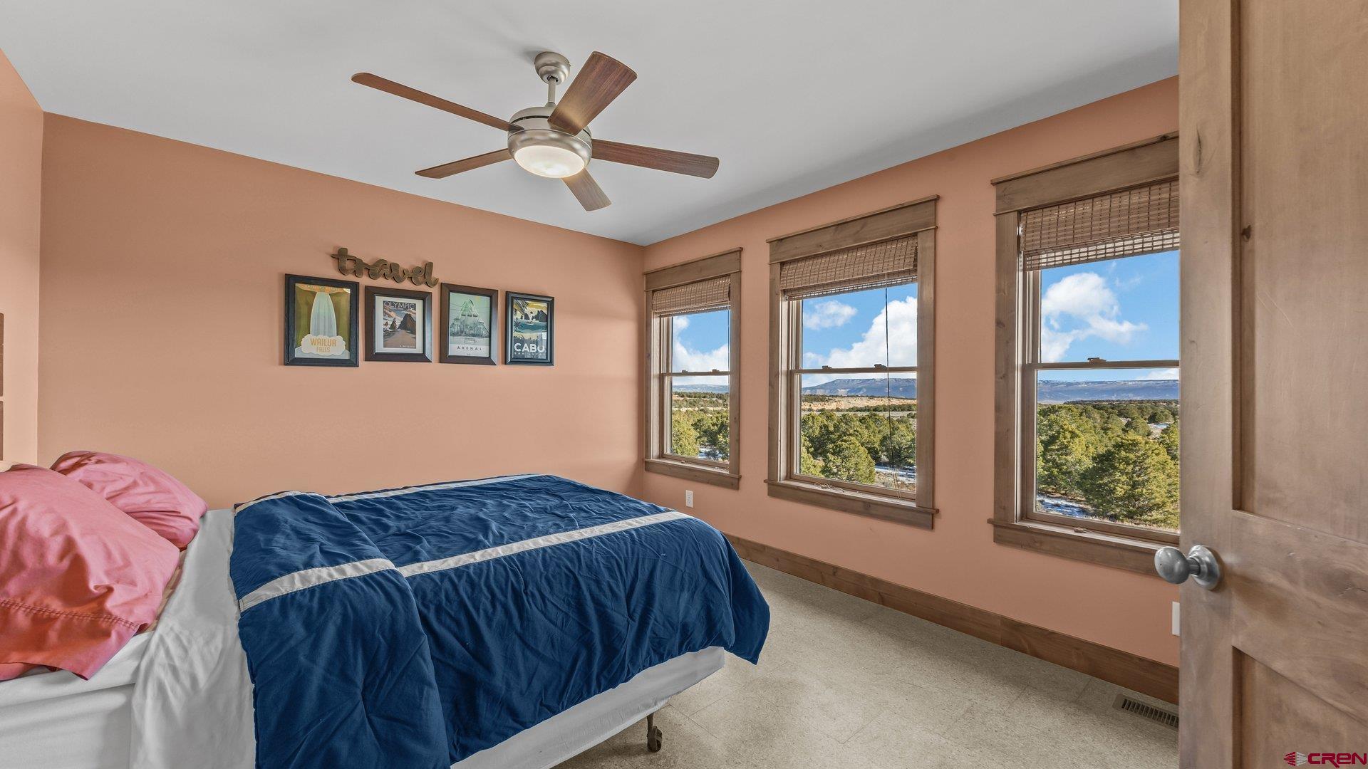 2601 South 21 1/2 Road Glade Park, CO 81523 - Photo 34 of 45 a bedroom with a large bed and a window