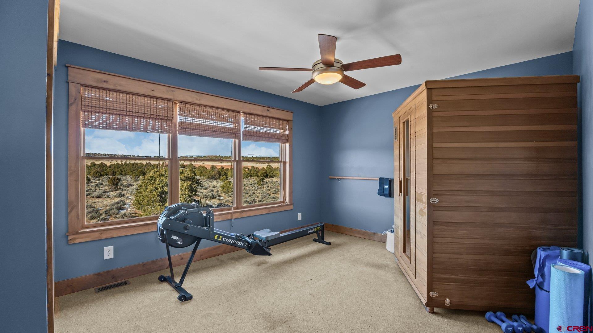 2601 South 21 1/2 Road Glade Park, CO 81523 - Photo 41 of 45 a view of a livingroom with a ceiling fan and a window