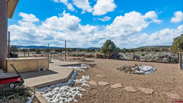 a bathroom with a toilet a sink and a mirror
