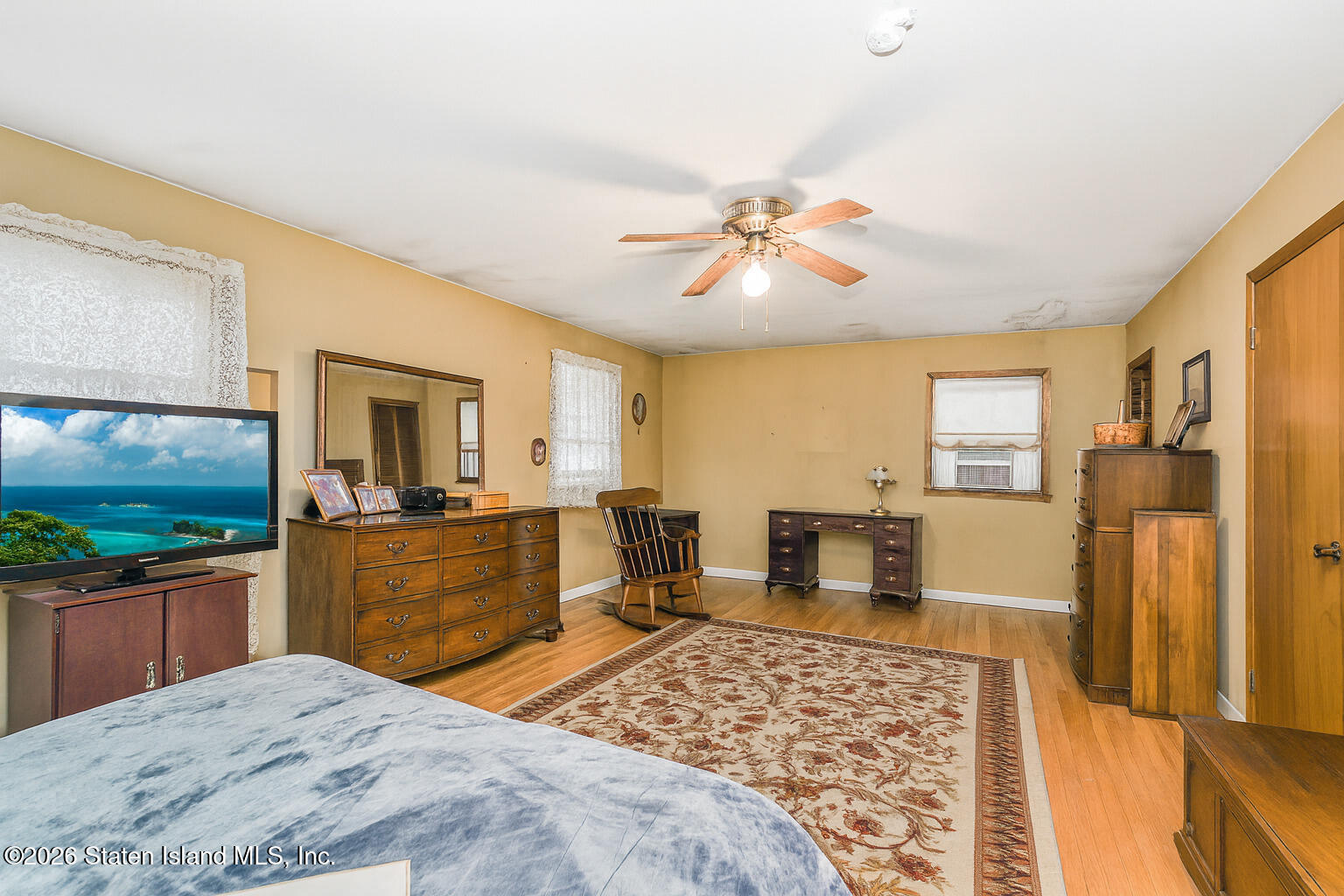 35 Shawnee Street Staten Island, NY 10310 - Photo 13 of 23 a bedroom with a bed and wooden floor