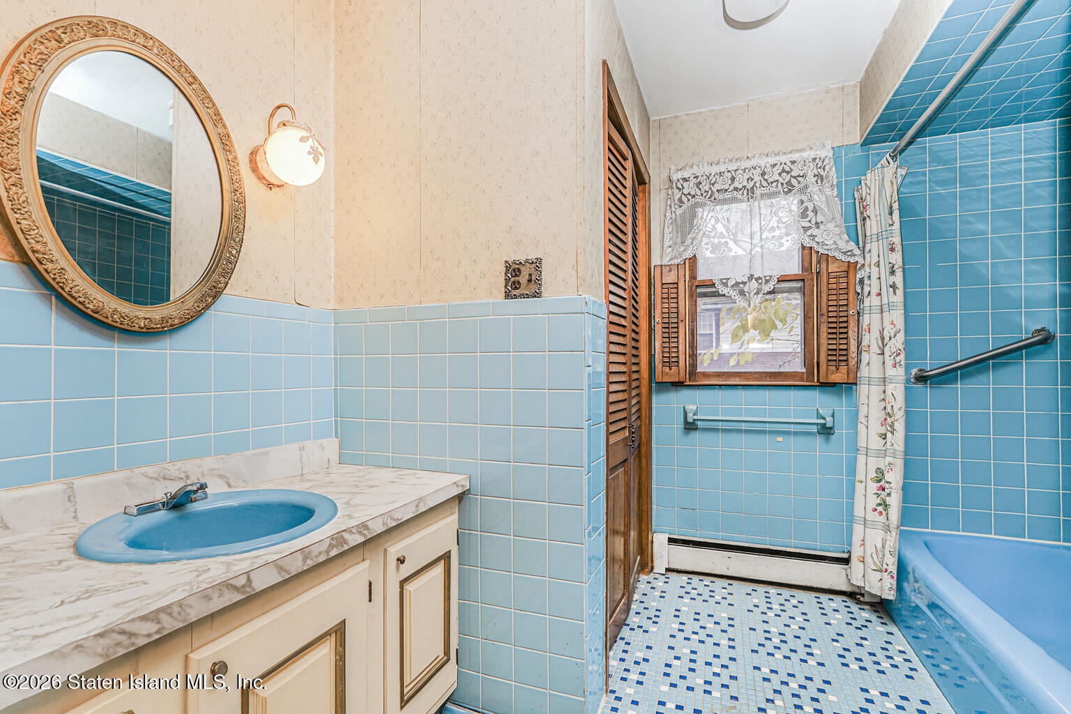 35 Shawnee Street Staten Island, NY 10310 - Photo 15 of 23 a bathroom with a sink a toilet and a mirror