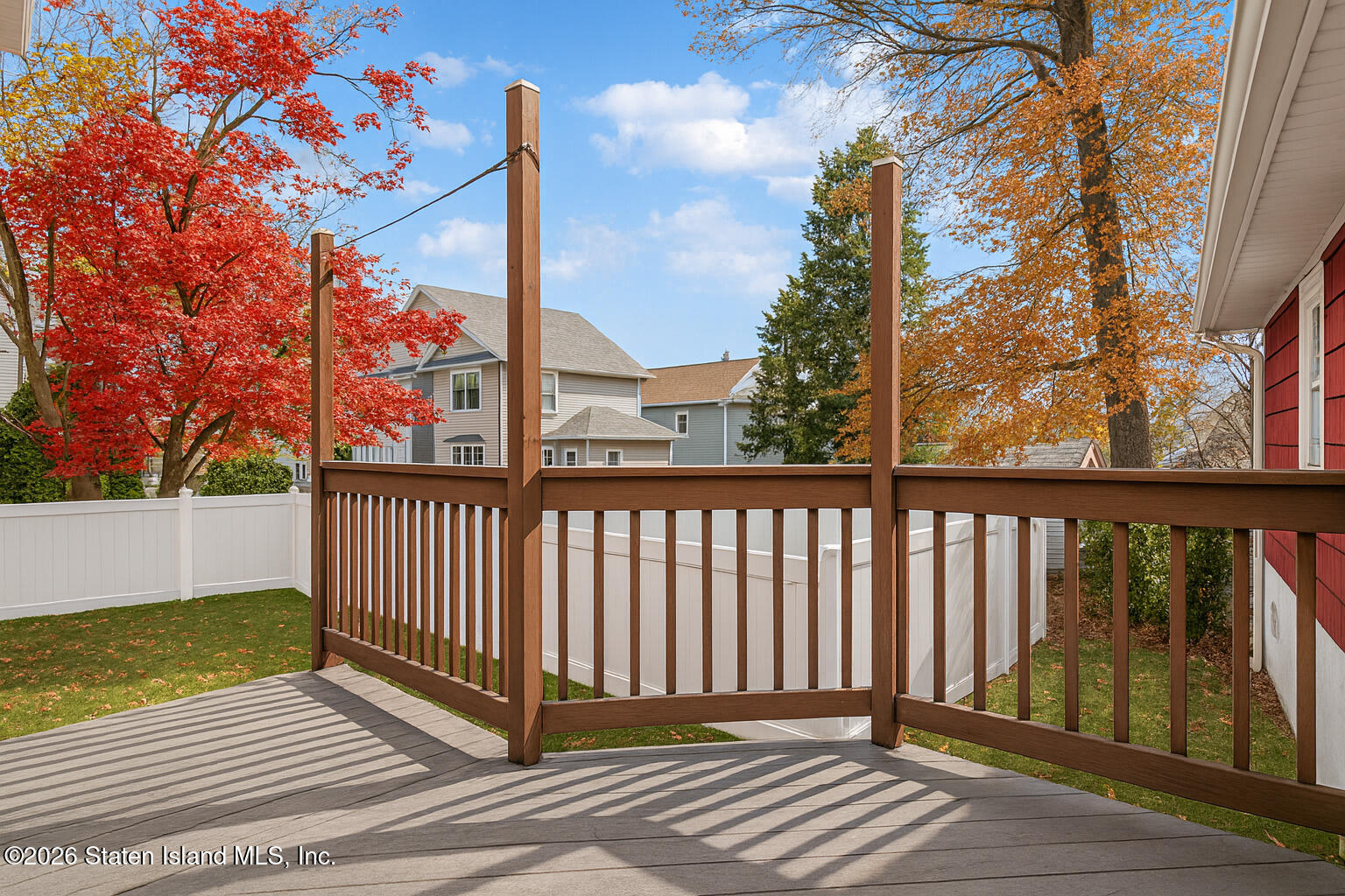 35 Shawnee Street Staten Island, NY 10310 - Photo 21 of 23 a view of a balcony with wooden floor and fence and a bench