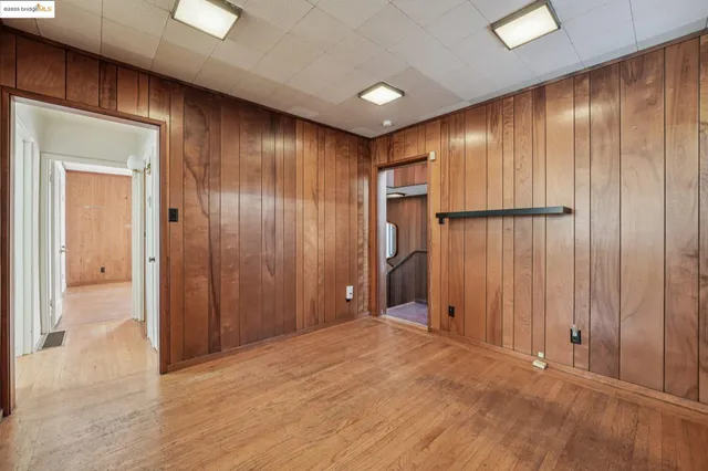 a bathroom with a granite countertop sink a toilet and a mirror