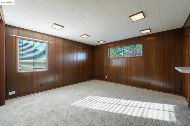 a view of a room with a wooden walls