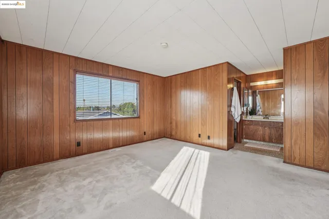 a room with a sink cabinets and utility