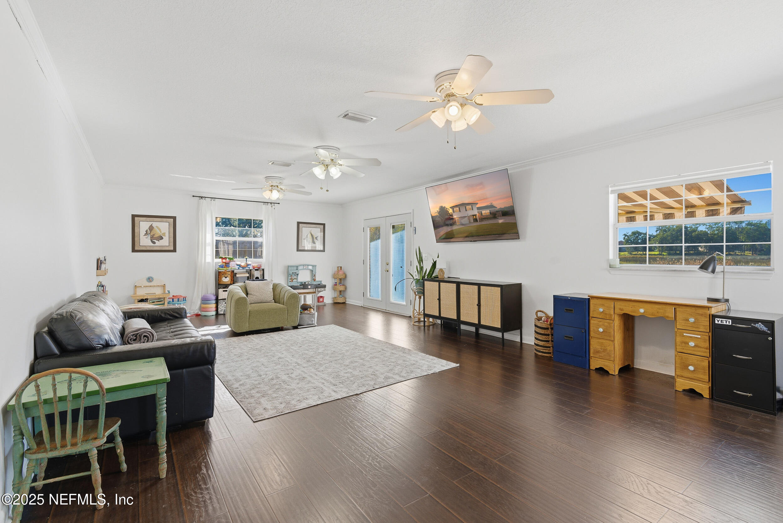 276 Baisden Road Jacksonville, FL 32218 - Photo 13 of 71 a living room with furniture and a wooden floor