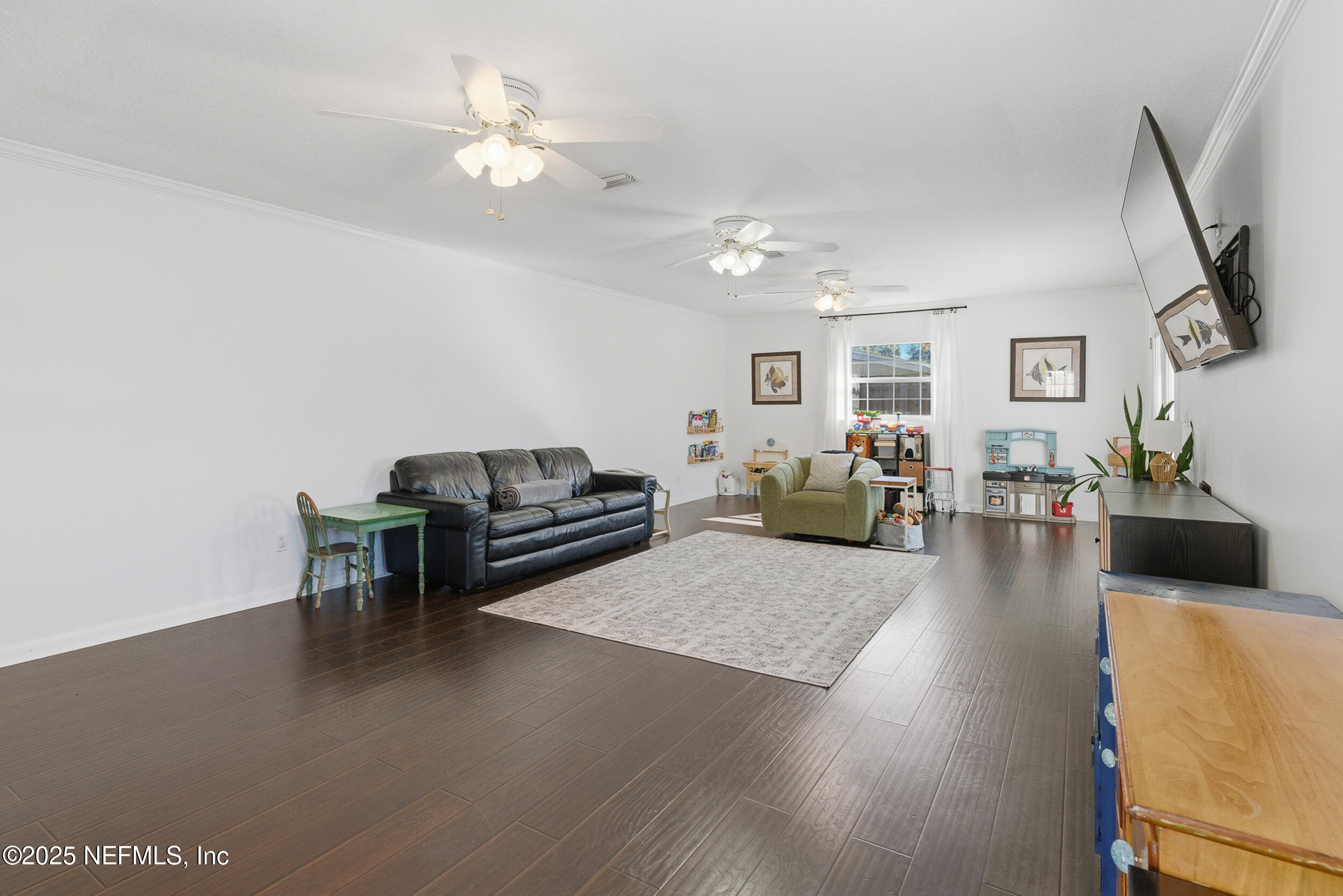 276 Baisden Road Jacksonville, FL 32218 - Photo 15 of 71 a living room with furniture and a flat screen tv