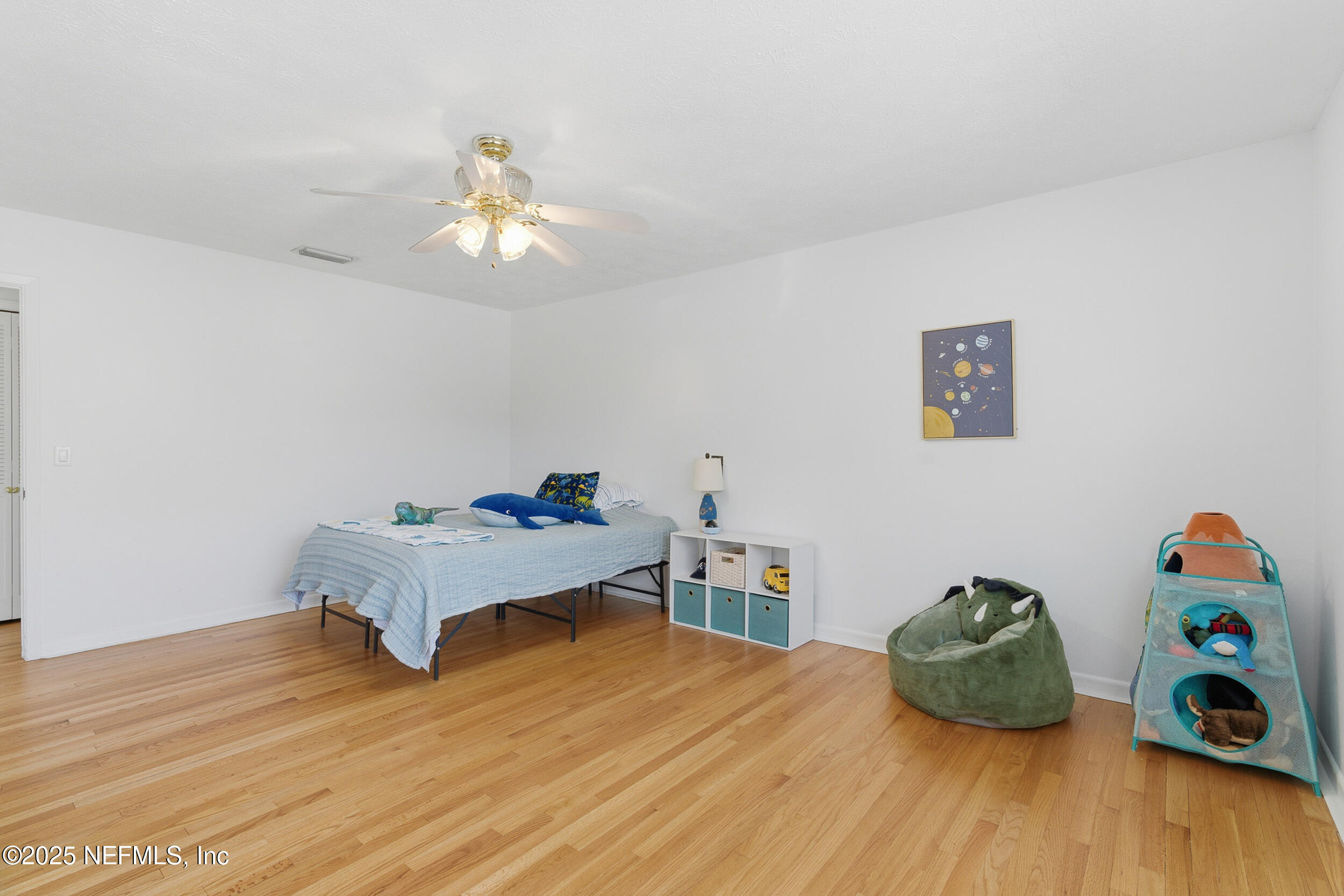 276 Baisden Road Jacksonville, FL 32218 - Photo 21 of 71 a bedroom with a bed and wooden floor