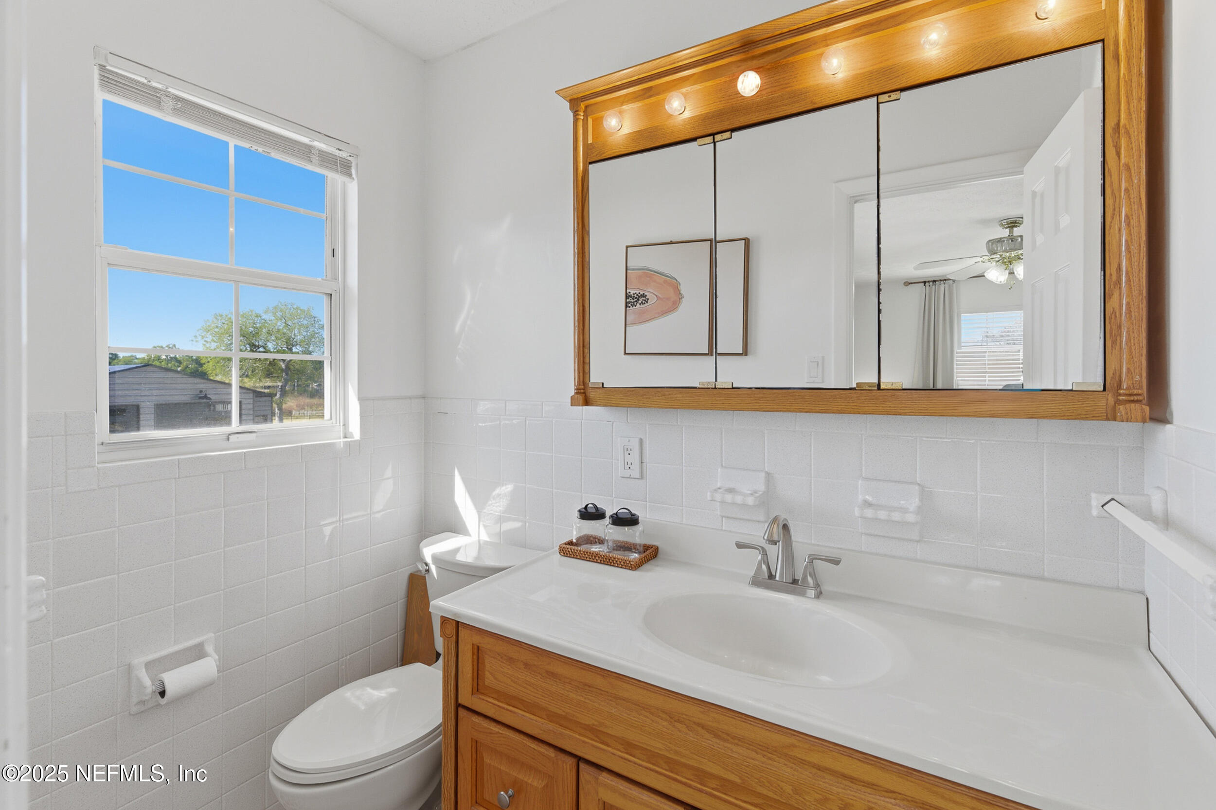 276 Baisden Road Jacksonville, FL 32218 - Photo 29 of 71 a bathroom with a sink a toilet and shower