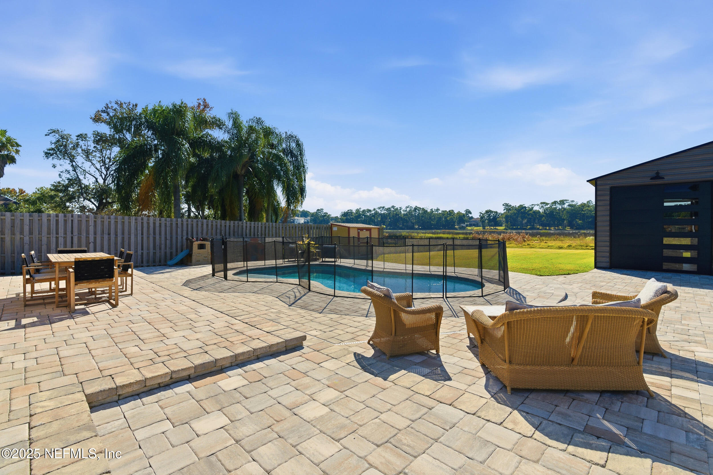276 Baisden Road Jacksonville, FL 32218 - Photo 30 of 71 a view of swimming pool with outdoor seating and yard in back