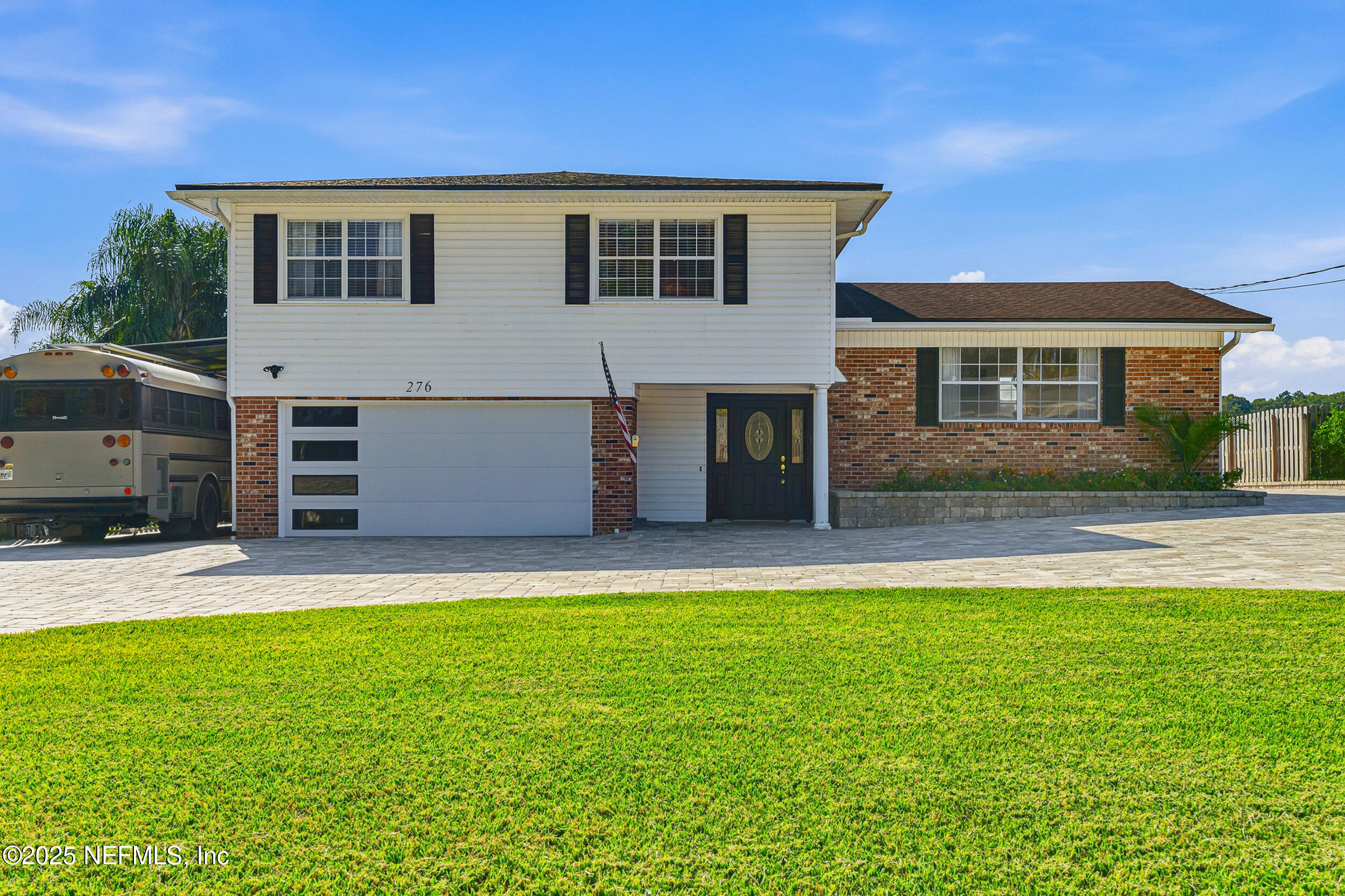 276 Baisden Road Jacksonville, FL 32218 - Photo 4 of 71 a front view of a house with a yard and garage