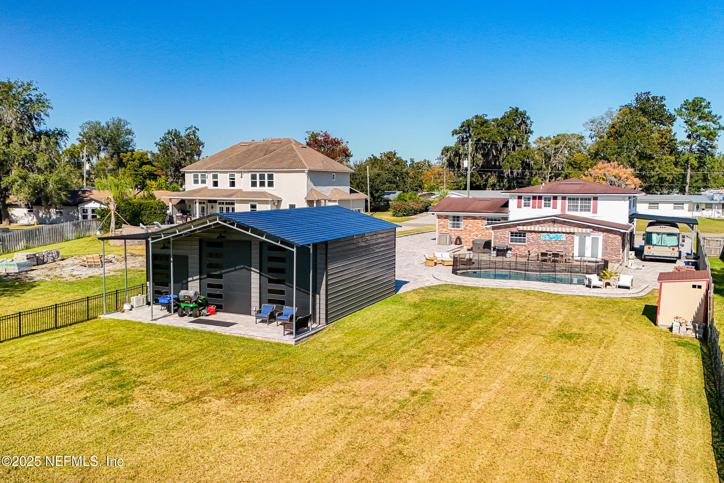 276 Baisden Road Jacksonville, FL 32218 - Photo 51 of 71 a view of a swimming pool with an outdoor seating