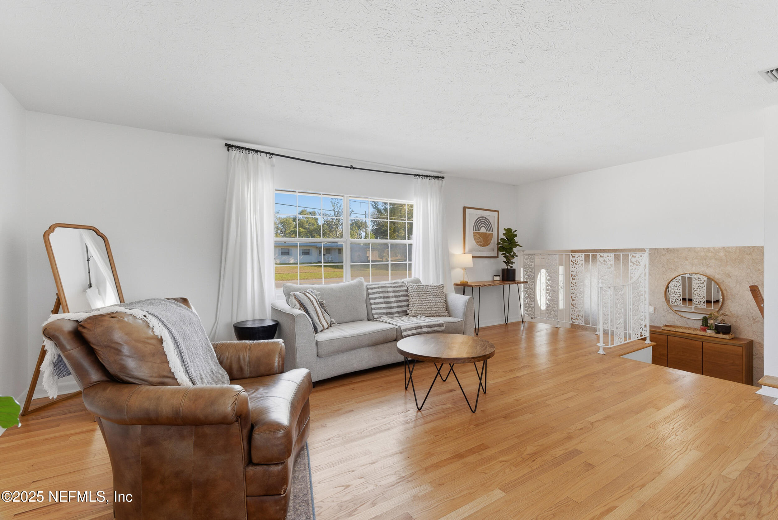 276 Baisden Road Jacksonville, FL 32218 - Photo 7 of 71 a living room with furniture and a large window