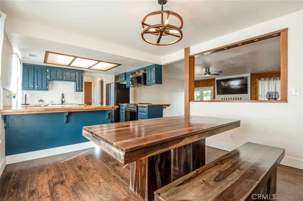 a kitchen with stainless steel appliances granite countertop a stove and a sink