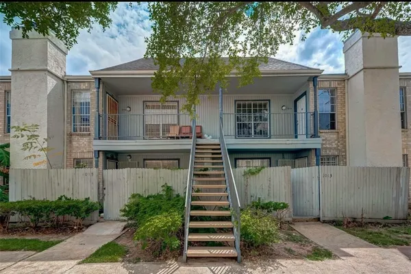 front view of a house with a small yard