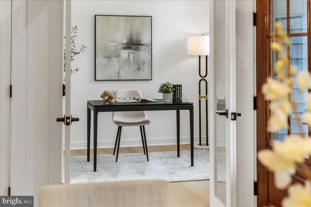 a view of a bathroom from a hallway