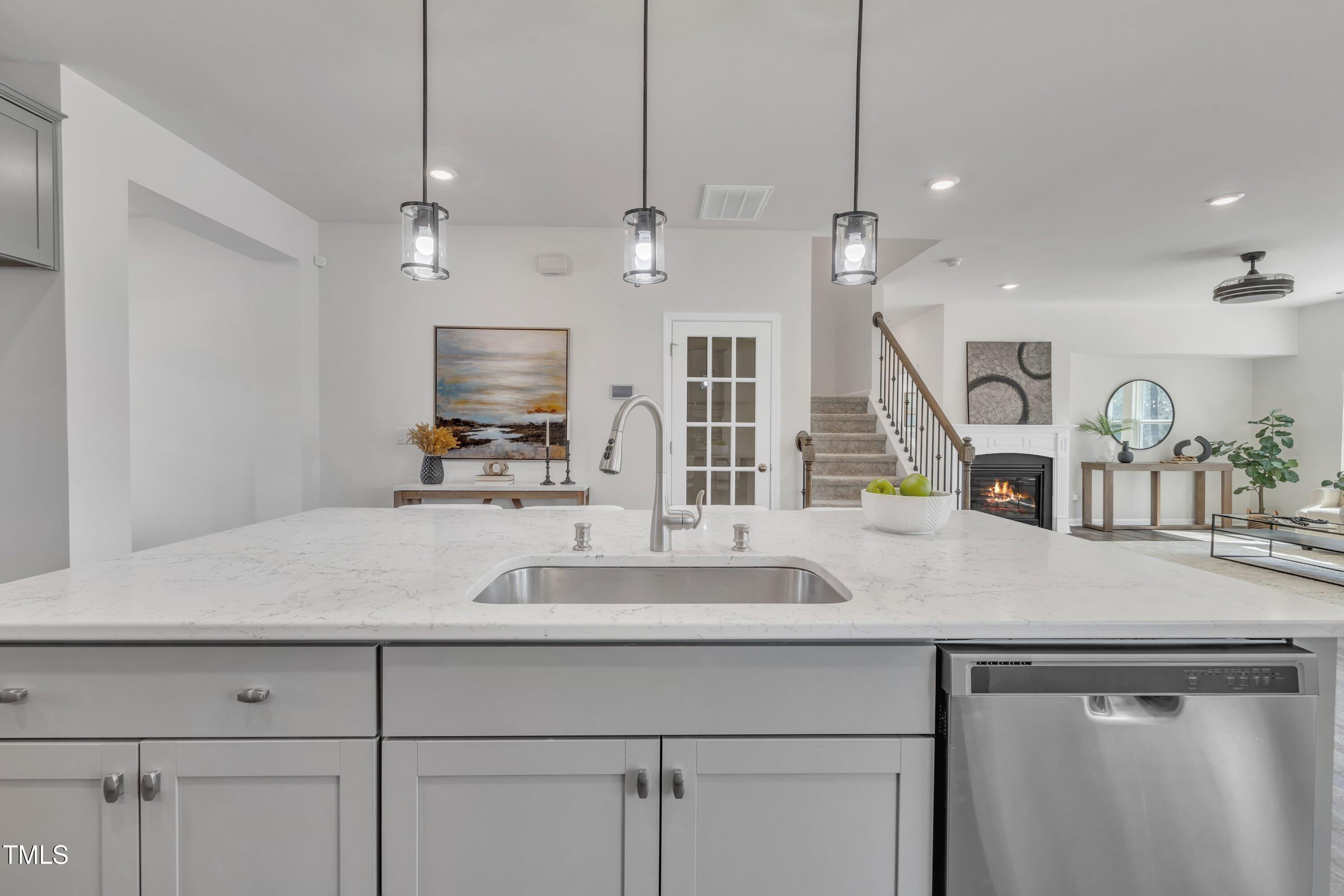 3381 Lovage Drive Apex, NC 27502 - Photo 12 of 50 a view with a sink a counter space and cabinets