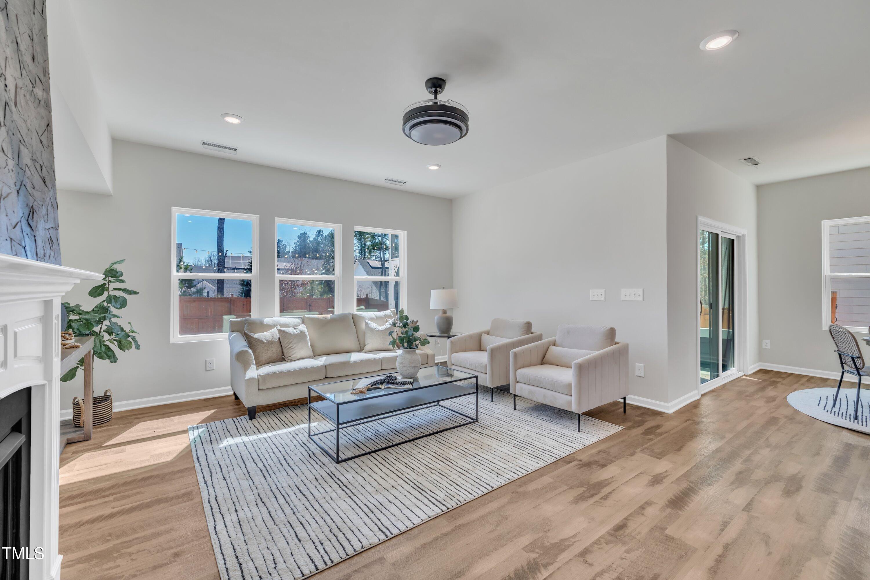 3381 Lovage Drive Apex, NC 27502 - Photo 23 of 50 a living room with furniture and a large window