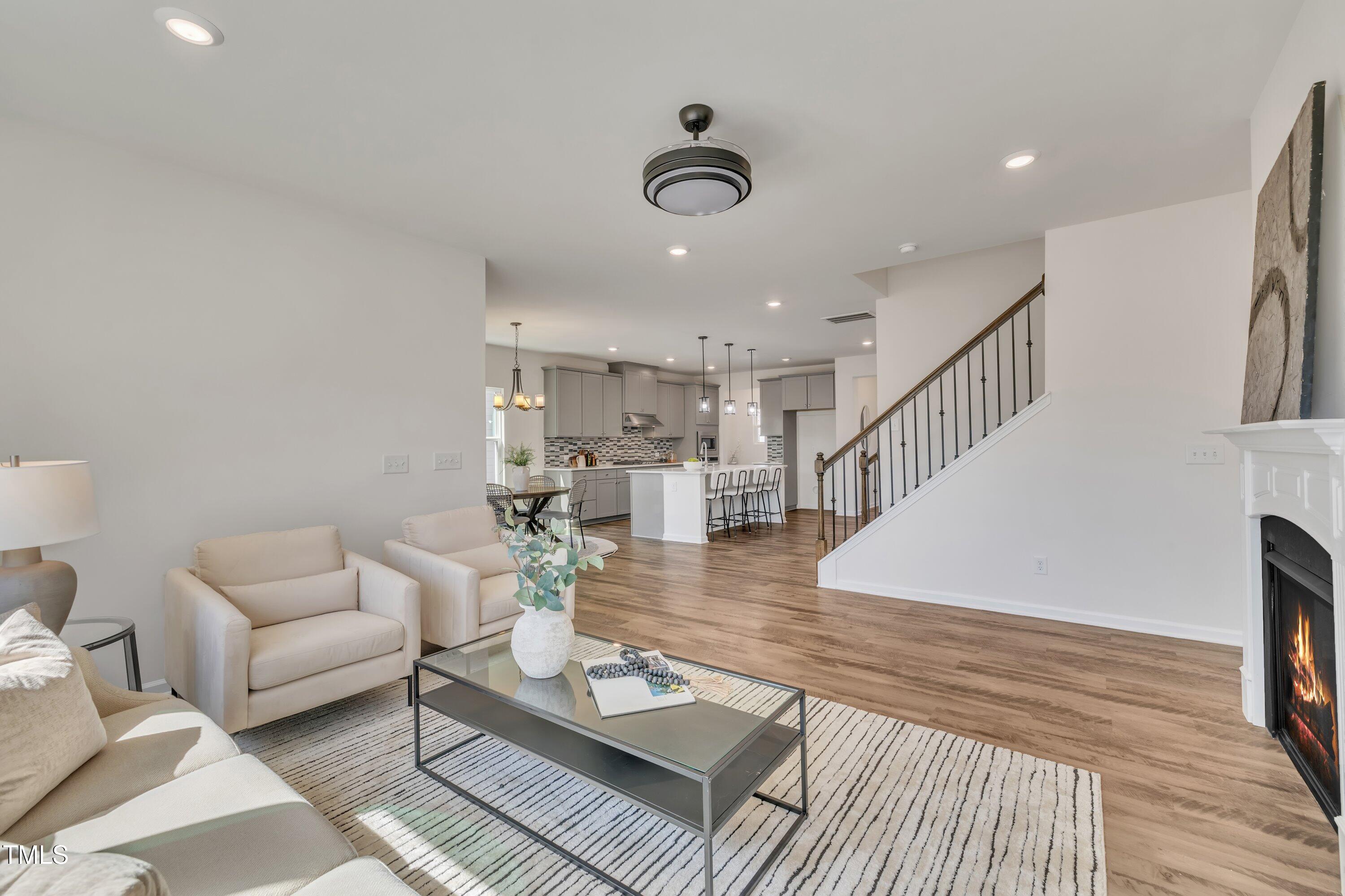 3381 Lovage Drive Apex, NC 27502 - Photo 24 of 50 a living room with furniture and a wooden floor
