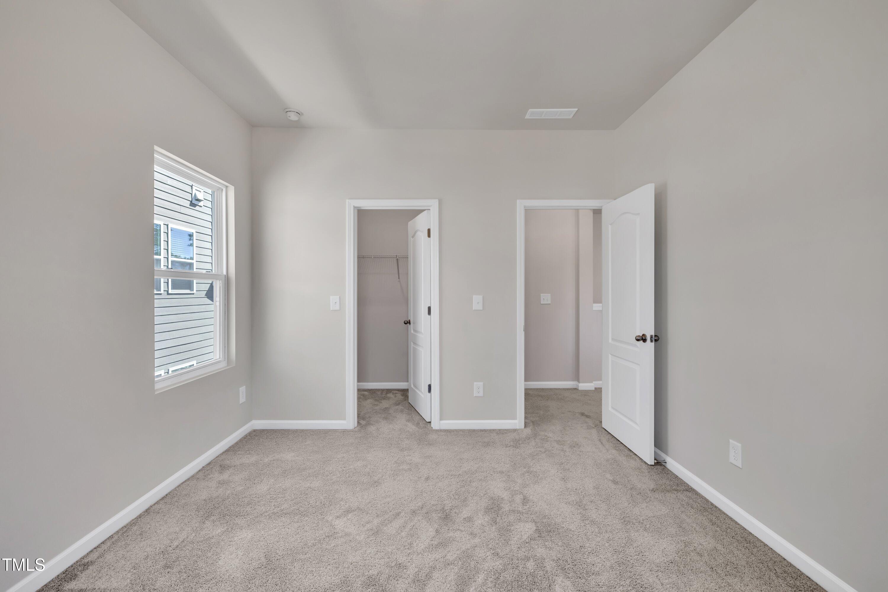 3381 Lovage Drive Apex, NC 27502 - Photo 33 of 50 an empty room with windows