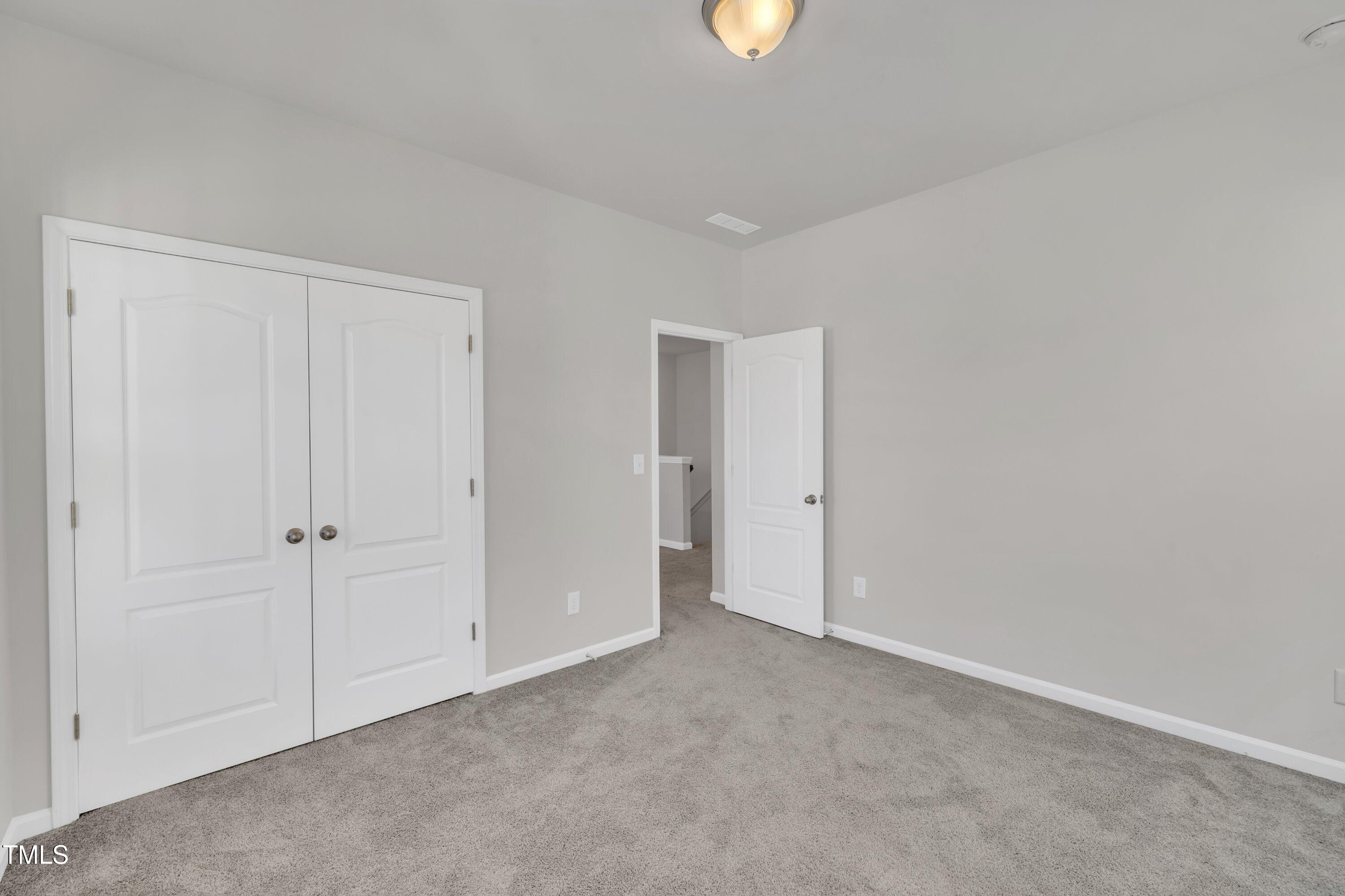 3381 Lovage Drive Apex, NC 27502 - Photo 36 of 50 an empty room with closet area