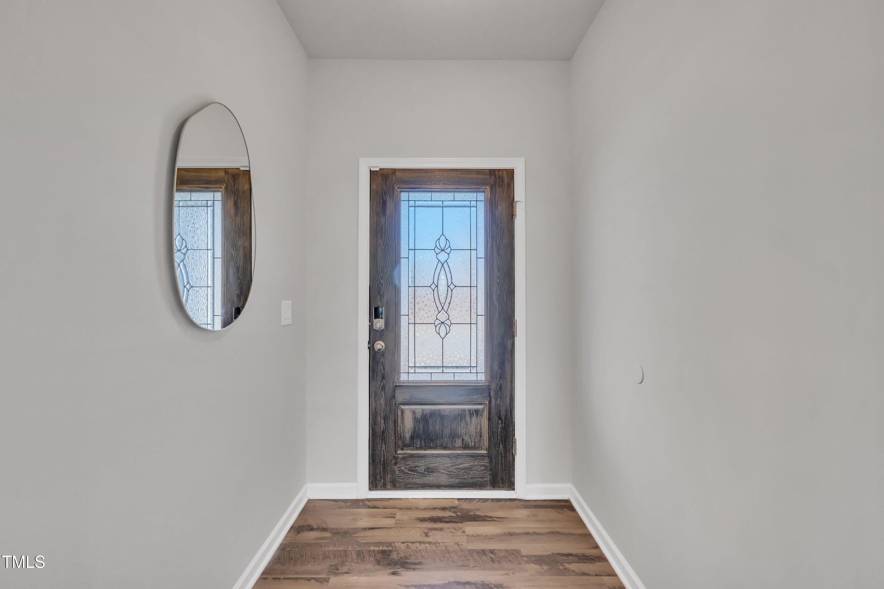 3381 Lovage Drive Apex, NC 27502 - Photo 6 of 50 a view of entryway with wooden floor